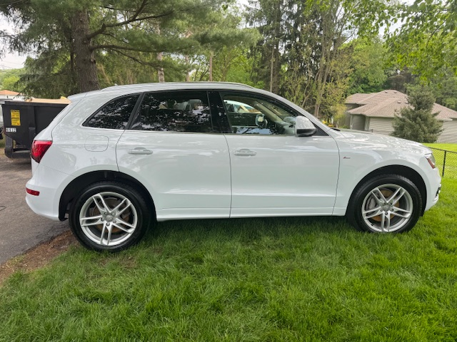 white suv with exterior detail and ceramic coating in Dorr
